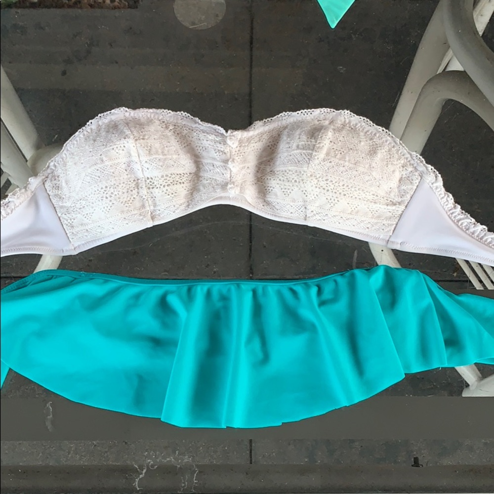Two strapless swim tops